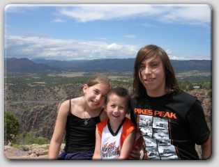 the kids sitting on the side of the gorge.  I blew up this pic and have it above the mantle on my fire place now.  :)