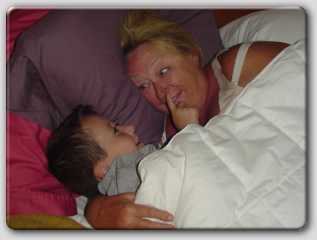 Mom's favorite part of vacation - Cody crawling in bed with her every morning to tell her a story.