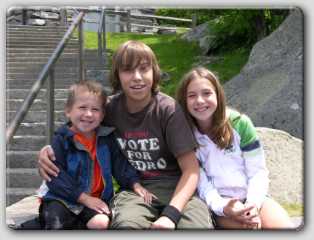 The kids taking a moment for a picture up in the mountains.